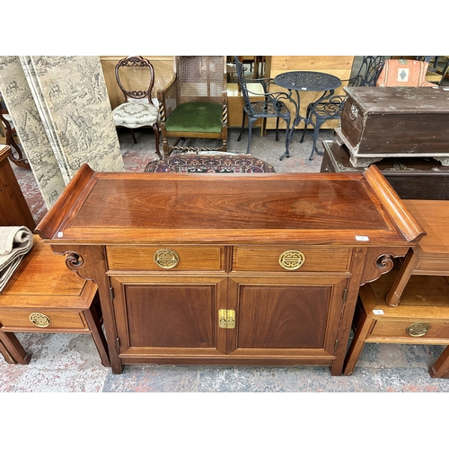 181 - A Chinese carved hardwood sideboard - approx. 88cm high x 124cm wide x 46cm deep