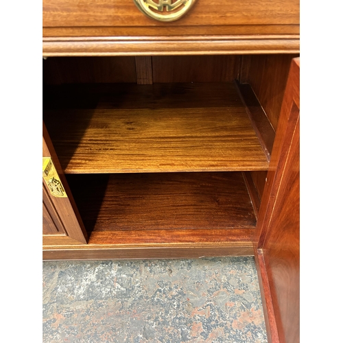 181 - A Chinese carved hardwood sideboard - approx. 88cm high x 124cm wide x 46cm deep