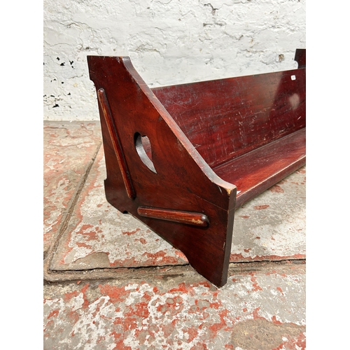 188 - An Arts & Crafts style stained hardwood book trough - approx. 30cm high x 81cm wide x 31cm deep