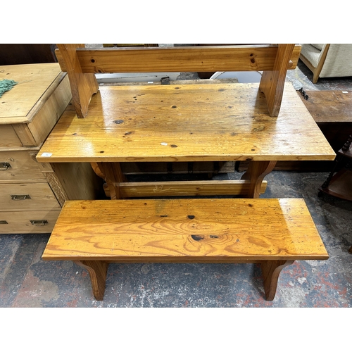 191 - A pine dining table and two benches - approx. 77cm high x 60cm wide x 113cm long