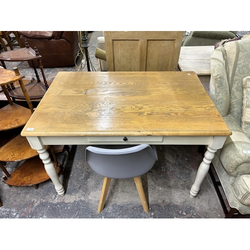 193 - A modern solid oak and white painted single drawer farmhouse dining table and grey plastic and beech... 