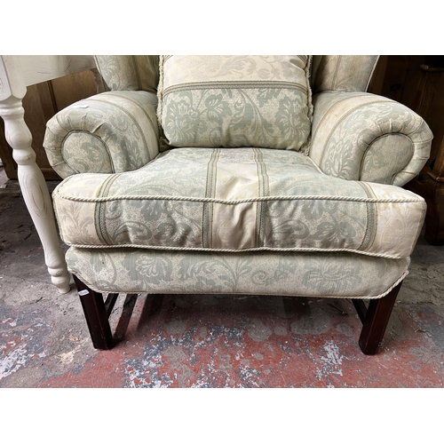 194 - A 19th century style green floral fabric upholstered and mahogany armchair