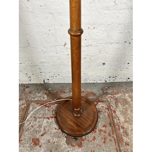 195 - A mid/late 20th century beech standard lamp with circular base - approx. 150cm high