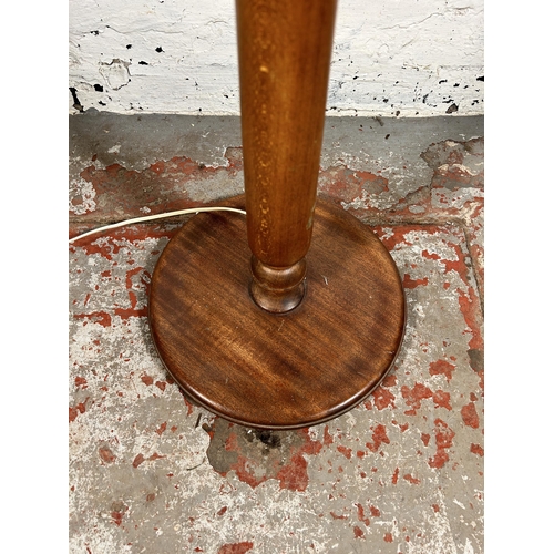 195 - A mid/late 20th century beech standard lamp with circular base - approx. 150cm high