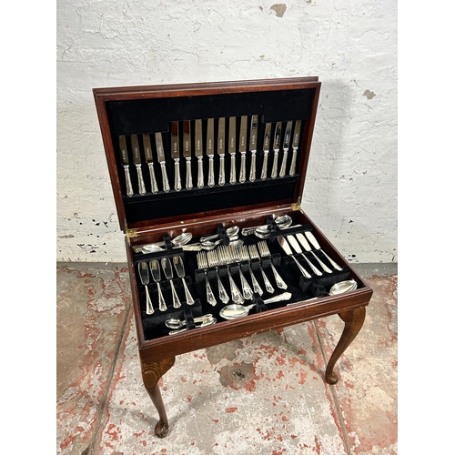 196 - A 19th century style mahogany and red leather cutlery table containing Cooper Ludlan silver plated t... 