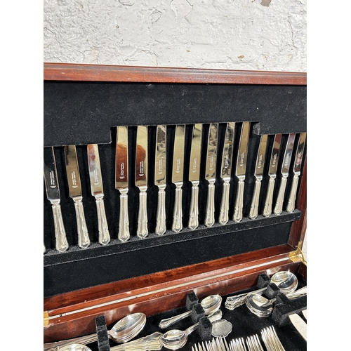 196 - A 19th century style mahogany and red leather cutlery table containing Cooper Ludlan silver plated t... 