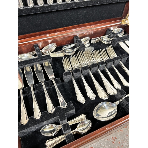 196 - A 19th century style mahogany and red leather cutlery table containing Cooper Ludlan silver plated t... 