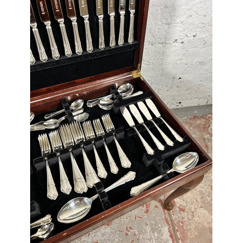 196 - A 19th century style mahogany and red leather cutlery table containing Cooper Ludlan silver plated t... 