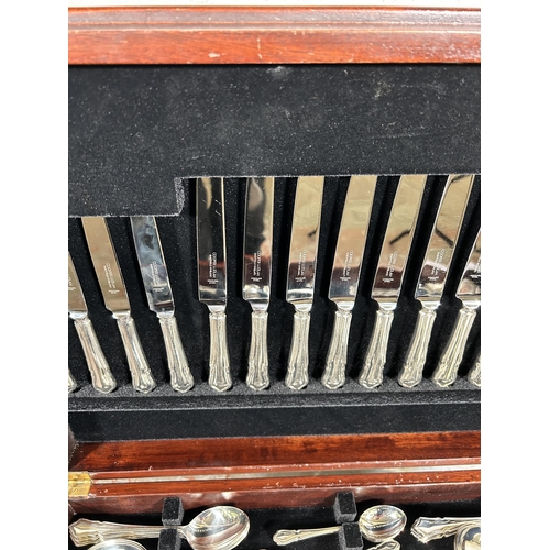 196 - A 19th century style mahogany and red leather cutlery table containing Cooper Ludlan silver plated t... 