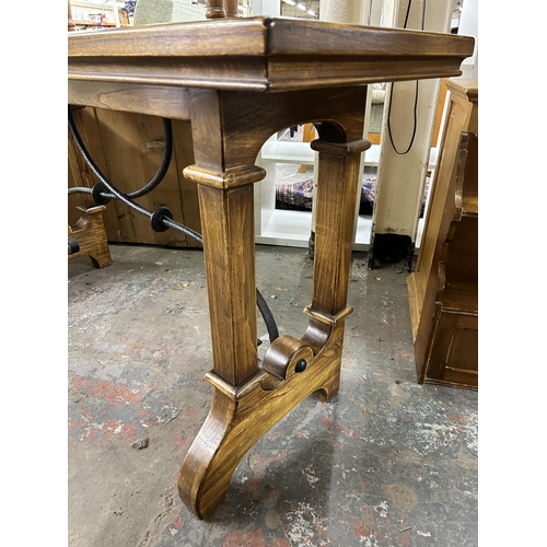 197 - A Gothic style solid oak and wrought iron console table - approx. 80cm high x 50cm wide x 150cm long