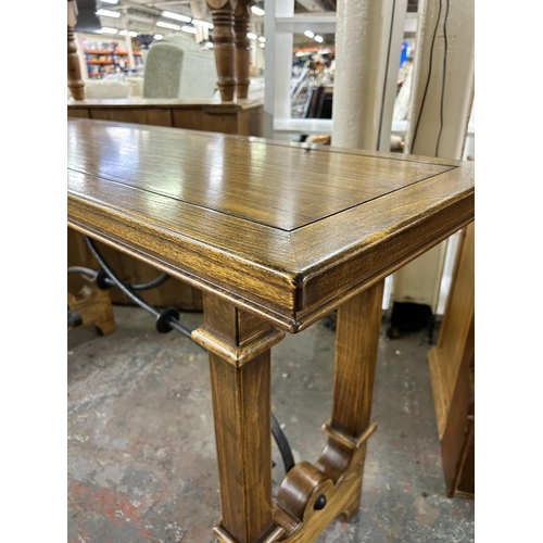 197 - A Gothic style solid oak and wrought iron console table - approx. 80cm high x 50cm wide x 150cm long