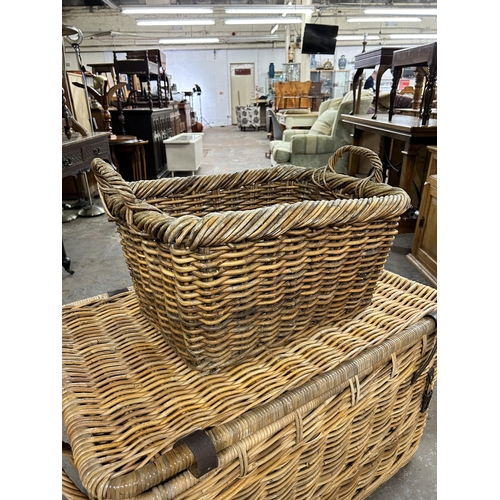 200 - Two wicker twin handled baskets - largest approx. 54cm high x 90cm wide x 56cm deep