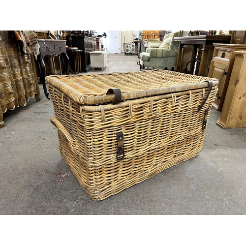 200 - Two wicker twin handled baskets - largest approx. 54cm high x 90cm wide x 56cm deep