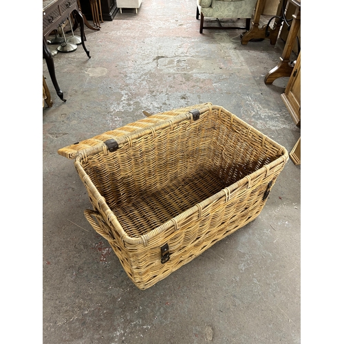 200 - Two wicker twin handled baskets - largest approx. 54cm high x 90cm wide x 56cm deep