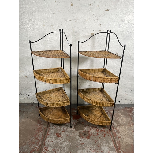 105 - A pair of wicker and black metal four tier corner shelving units - approx. 106cm high x 48cm wide x ... 