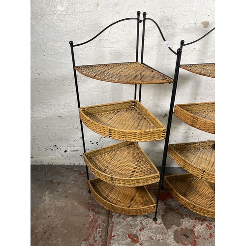 105 - A pair of wicker and black metal four tier corner shelving units - approx. 106cm high x 48cm wide x ... 