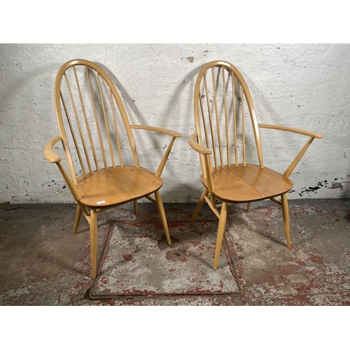 111 - A pair of Ercol Windsor blonde elm and beech Quaker carver dining chairs