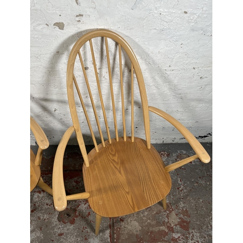 111 - A pair of Ercol Windsor blonde elm and beech Quaker carver dining chairs