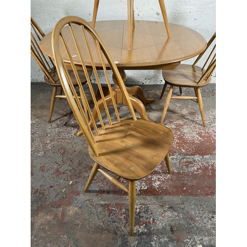 112 - An Ercol Windsor blonde elm and beech oval extending dining table and four Quaker dining chairs - ap... 