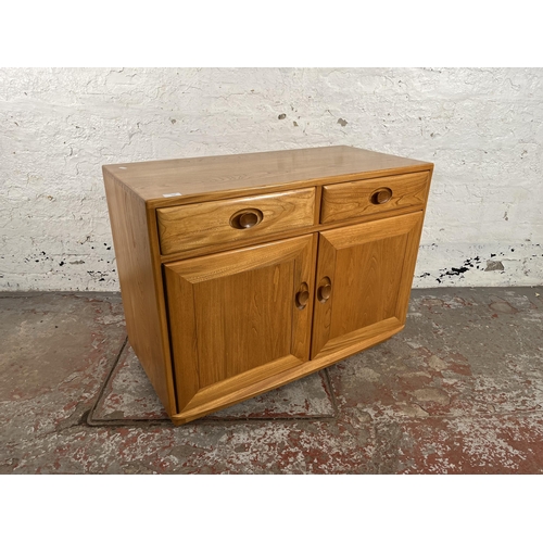 113 - An Ercol Windsor blonde elm sideboard - approx. 69cm high x 91cm wide x 43cm deep