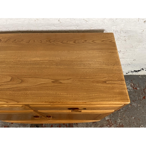 113 - An Ercol Windsor blonde elm sideboard - approx. 69cm high x 91cm wide x 43cm deep