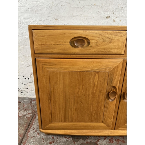 113 - An Ercol Windsor blonde elm sideboard - approx. 69cm high x 91cm wide x 43cm deep