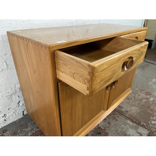 113 - An Ercol Windsor blonde elm sideboard - approx. 69cm high x 91cm wide x 43cm deep