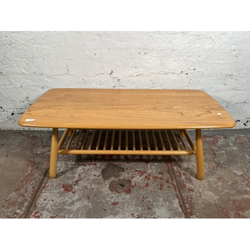 116 - An Ercol Windsor blonde elm and beech coffee table - approx. 37cm high x 48cm wide x 102cm long
