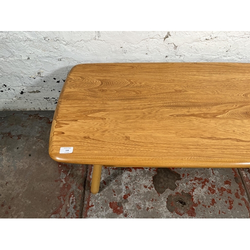 116 - An Ercol Windsor blonde elm and beech coffee table - approx. 37cm high x 48cm wide x 102cm long