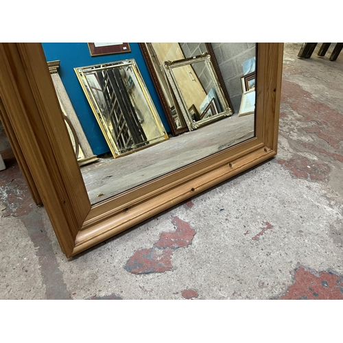 15 - Two pine framed wall mirrors - approx. 96cm high x 79cm wide