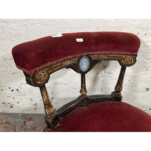 18 - A Victorian inlaid burr walnut and ebonised nursing chair with red fabric upholstery and Jasperware ... 