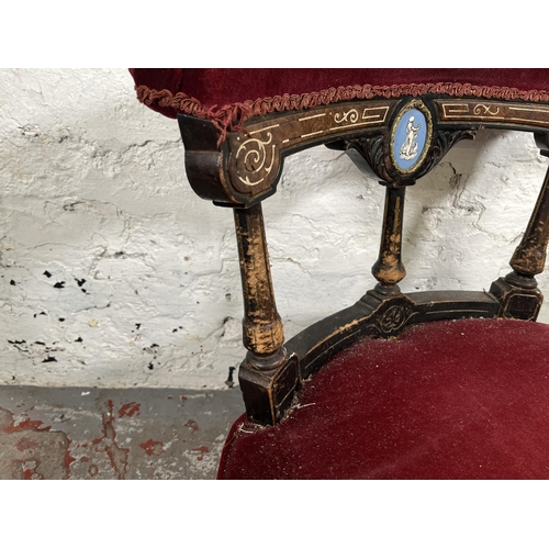18 - A Victorian inlaid burr walnut and ebonised nursing chair with red fabric upholstery and Jasperware ... 