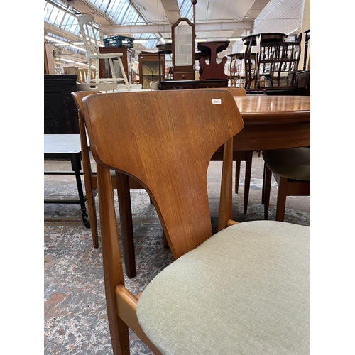 24 - A mid 20th century Elliotts of Newbury (EON) teak circular extending dining table and four chairs - ... 