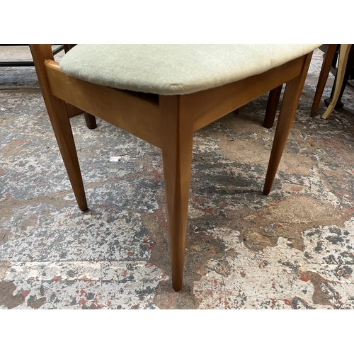24 - A mid 20th century Elliotts of Newbury (EON) teak circular extending dining table and four chairs - ... 