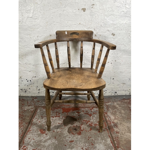 41 - A late 19th century elm and beech smoker's bow chair - approx. 82cm high x 54cm wide x 46cm deep