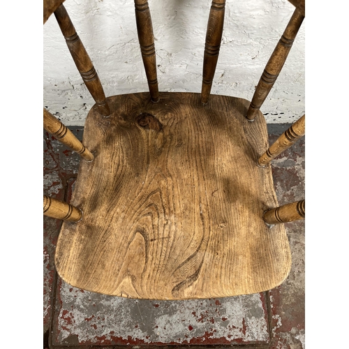 41 - A late 19th century elm and beech smoker's bow chair - approx. 82cm high x 54cm wide x 46cm deep