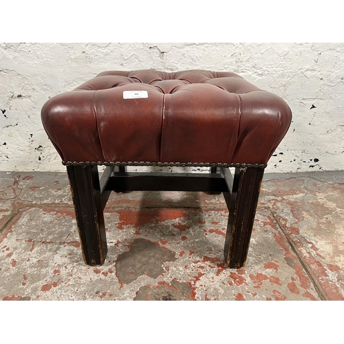 48 - A Chesterfield red leather footstool - approx. 37cm high x 42cm wide x 42cm deep
