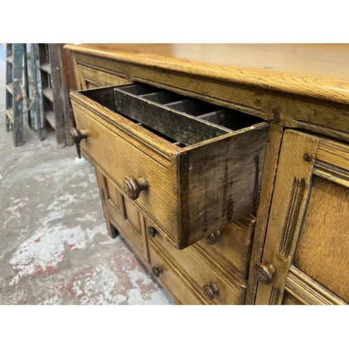 5 - An Ercol Old Colonial elm sideboard - approx. 92cm high x 146cm wide x 51cm deep