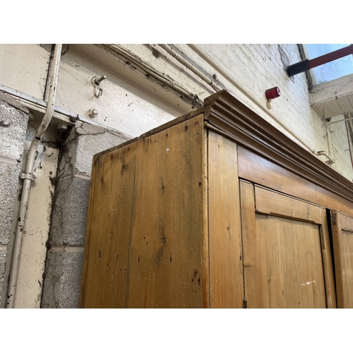 6 - A Victorian pine four door housekeeper's cupboard - approx. 218cm high x 140cm wide x 51cm deep