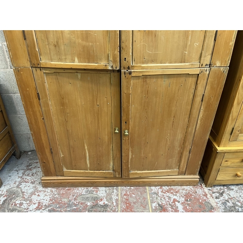 6 - A Victorian pine four door housekeeper's cupboard - approx. 218cm high x 140cm wide x 51cm deep