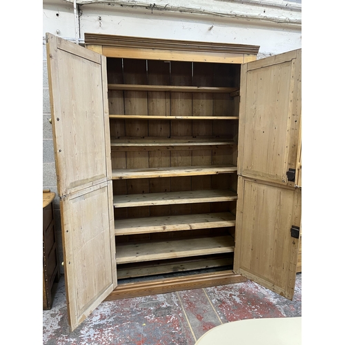 6 - A Victorian pine four door housekeeper's cupboard - approx. 218cm high x 140cm wide x 51cm deep