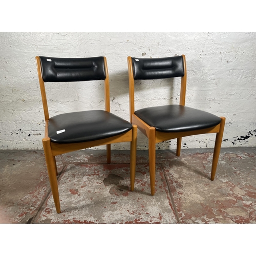 70 - A pair of mid 20th century beech and black vinyl dining chairs