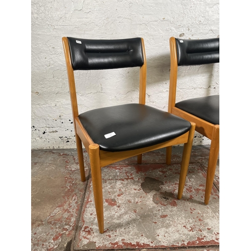 70 - A pair of mid 20th century beech and black vinyl dining chairs