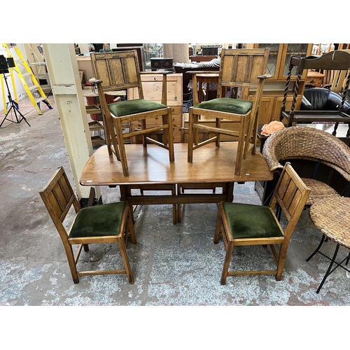 71 - An Ercol Old Colonial elm dining table and six chairs - approx. 72cm high x 74cm wide x 152cm long