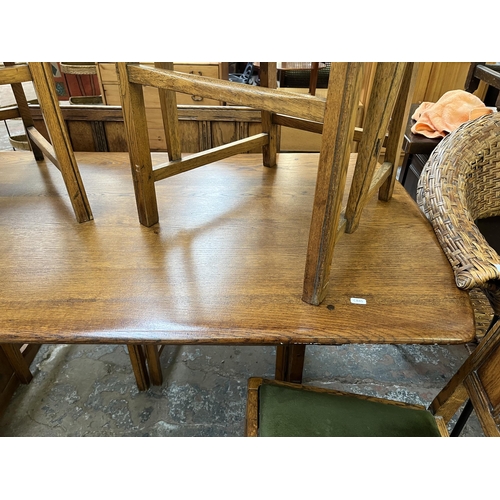 71 - An Ercol Old Colonial elm dining table and six chairs - approx. 72cm high x 74cm wide x 152cm long