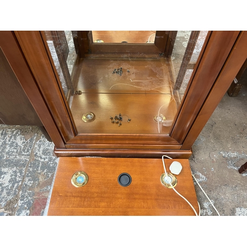 76 - A French cherrywood and glass single door display cabinet with three glass shelves - approx. 162cm h... 