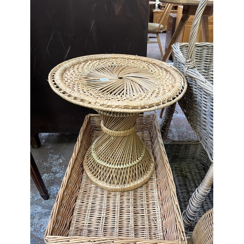 78 - A collection of wicker baskets and furniture to include bottle rack, circular side table etc.