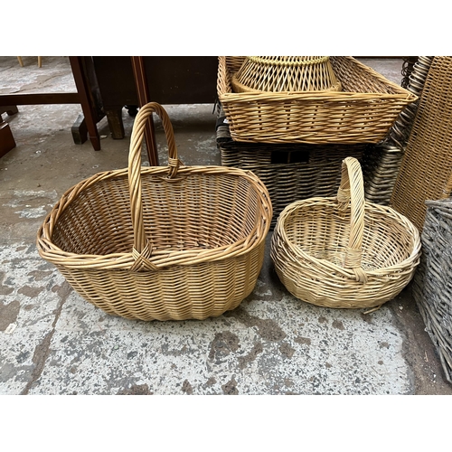 78 - A collection of wicker baskets and furniture to include bottle rack, circular side table etc.