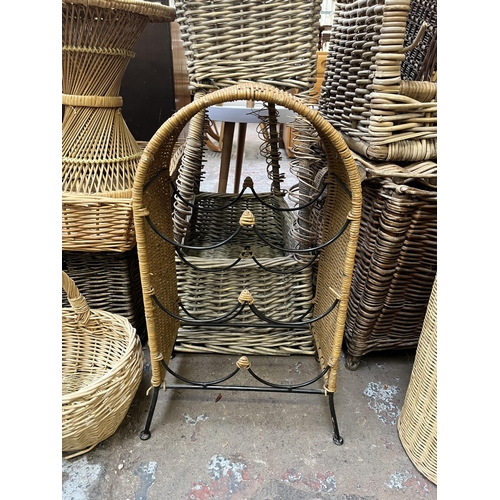 78 - A collection of wicker baskets and furniture to include bottle rack, circular side table etc.