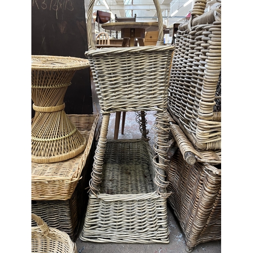 78 - A collection of wicker baskets and furniture to include bottle rack, circular side table etc.